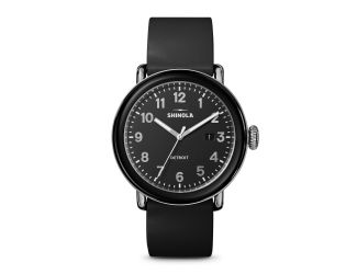 Detrola is designed with a classic silhouette and bold attitude. Black rubber strap with traditional buckle closure. Black dial with Arabic numerals and three hands. Day of the month calendar by the 3 position. Black stainless steel and TR 90 resin bezel 