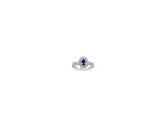 A deep sea of blue, encircled by magical ice. Make a royal statement with this striking ring that features a passionately blue 5x3mm oval blue sapphire surrounded by a halo of .10twt round brilliant-cut diamonds set in lustrous 14k white gold. Available i